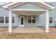 View of the covered patio with a concrete floor, ceiling fan, and access to the backyard at 124 August Pond Way # 138, Raleigh, NC 27603