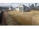 Large backyard with new home, grassy area, and a privacy fence at 1111 Woody Dr, Graham, NC 27253
