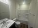 Simple bathroom with a single vanity and tub at 1111 Woody Dr, Graham, NC 27253