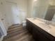 Bathroom with double vanity and a walk-in shower at 1111 Woody Dr, Graham, NC 27253