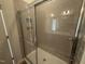 Clean bathroom with shower/tub combo and tiled walls at 1111 Woody Dr, Graham, NC 27253