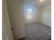 Bright bedroom with grey carpet and a window at 1111 Woody Dr, Graham, NC 27253