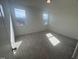 Well-lit bedroom featuring neutral carpeting and large windows at 1111 Woody Dr, Graham, NC 27253