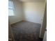 Simple bedroom featuring carpet flooring and a window offering natural light at 1111 Woody Dr, Graham, NC 27253