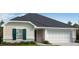 One-story home with neutral siding, dark roof, and a two-car garage at 1111 Woody Dr, Graham, NC 27253