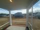 Relaxing screened porch overlooking backyard and houses beyond at 1111 Woody Dr, Graham, NC 27253