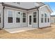 New construction home with a concrete patio, gray siding, and a well-manicured yard ready for landscaping at 134 Black Walnut Dr # 205, Garner, NC 27529