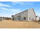New construction home with gray siding and a spacious yard, ready for landscaping and outdoor enjoyment at 134 Black Walnut Dr # 205, Garner, NC 27529