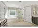Spa-like bathroom with soaking tub, glass-enclosed shower, and modern fixtures at 134 Black Walnut Dr # 205, Garner, NC 27529