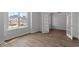 Bright bedroom with natural light, wood-look floors, and french doors at 134 Black Walnut Dr # 205, Garner, NC 27529