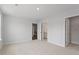 Comfortable carpeted bedroom with two doorways and recessed lighting at 134 Black Walnut Dr # 205, Garner, NC 27529