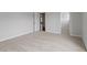 Spacious bedroom with neutral carpeting and trim, offering a blank canvas ready for personalization at 134 Black Walnut Dr # 205, Garner, NC 27529
