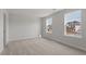 Bright bedroom with carpet, white trim, and large windows for natural light at 134 Black Walnut Dr # 205, Garner, NC 27529