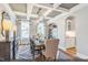 Elegant dining room with coffered ceilings, stylish chandelier, and large windows at 134 Black Walnut Dr # 205, Garner, NC 27529