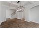 Dining room featuring wood-look floors and modern light fixture at 134 Black Walnut Dr # 205, Garner, NC 27529