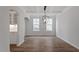 Spacious dining room with coffered ceiling and modern chandelier at 134 Black Walnut Dr # 205, Garner, NC 27529