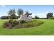 Community entrance sign surrounded by landscaping and green grass in the foreground at 134 Black Walnut Dr # 205, Garner, NC 27529