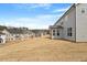 Exterior shot of a row of homes with gray siding, offering a sense of community at 134 Black Walnut Dr # 205, Garner, NC 27529