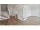 Inviting foyer with wood-look floors, staircase, and arched doorway at 134 Black Walnut Dr # 205, Garner, NC 27529