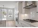 Modern kitchen with white cabinets, subway tile backsplash, and stainless steel appliances at 134 Black Walnut Dr # 205, Garner, NC 27529