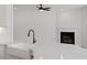 Bright kitchen featuring a large quartz countertop island and farmhouse sink with black faucet at 134 Black Walnut Dr # 205, Garner, NC 27529