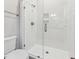 Modern bathroom featuring a glass-enclosed shower with white subway tile at 208 Regency Ridge Dr, Holly Springs, NC 27540