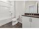 Bathroom featuring tub, dark countertop vanity with white cabinets, and tile floors at 208 Regency Ridge Dr, Holly Springs, NC 27540
