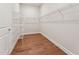 Walk-in closet with wood flooring and wire shelving to maximize storage space at 208 Regency Ridge Dr, Holly Springs, NC 27540