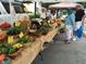 Bountiful farmers market with fresh produce on display under a tented stall at 208 Regency Ridge Dr, Holly Springs, NC 27540