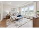 Bright bedroom with a king bed, large windows, recessed lighting, and tray ceiling at 208 Regency Ridge Dr, Holly Springs, NC 27540