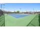 Well-maintained community tennis courts surrounded by green landscaping and fencing at 208 Regency Ridge Dr, Holly Springs, NC 27540