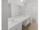 Bathroom featuring an extended vanity, large mirror, and new fixtures at 104 Mossbark Ln, Chapel Hill, NC 27514