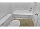 Clean, basic full bathroom with tub and toilet at 104 Mossbark Ln, Chapel Hill, NC 27514