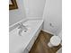 A cozy bathroom featuring a clean white sink and a matching toilet at 104 Mossbark Ln, Chapel Hill, NC 27514