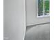 Bright bedroom with a large window overlooking the outdoors and soft grey carpeted floor at 104 Mossbark Ln, Chapel Hill, NC 27514
