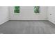 Bright, spacious bedroom featuring neutral carpet and double windows at 104 Mossbark Ln, Chapel Hill, NC 27514