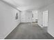 Open bedroom featuring a window, closet and entry to the home at 104 Mossbark Ln, Chapel Hill, NC 27514
