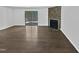 Open living room with stone fireplace and sliding glass doors at 104 Mossbark Ln, Chapel Hill, NC 27514