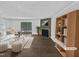 Inviting living room with fireplace and sliding glass doors to the backyard at 104 Mossbark Ln, Chapel Hill, NC 27514