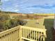 Backyard view with partial stream and abundant greenery, seen from the wooden deck at 116 Bristow Ct # 49, Four Oaks, NC 27524
