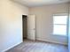 Bedroom boasts neutral walls, soft carpeting, and a window for natural light at 116 Bristow Ct # 49, Four Oaks, NC 27524