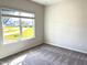 Bedroom with carpeted floors and a bright window providing a neighborhood view at 116 Bristow Ct # 49, Four Oaks, NC 27524