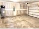Unfinished two car garage with concrete floors and water heater at 116 Bristow Ct # 49, Four Oaks, NC 27524