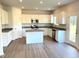 Modern kitchen features stainless steel appliances, granite countertops, and white cabinetry at 116 Bristow Ct # 49, Four Oaks, NC 27524