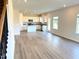 Open kitchen concept featuring granite countertops, stainless appliances, and eat in dining at 116 Bristow Ct # 49, Four Oaks, NC 27524