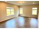 Spacious living room boasts recessed lighting, ample windows, and modern vinyl flooring at 116 Bristow Ct # 49, Four Oaks, NC 27524
