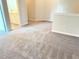 Neutral-toned loft space featuring plush carpeting and a view into the adjacent bathroom at 116 Bristow Ct # 49, Four Oaks, NC 27524