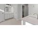 Bright bathroom with double sink vanity, quartz counters and walk-in closet at 125 Bold Dr, Youngsville, NC 27596