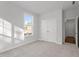 Bright bedroom with carpet, closet, and natural light creating a warm and welcoming space at 125 Bold Dr, Youngsville, NC 27596