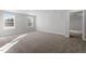 Spacious carpeted bedroom featuring bright windows and neutral paint, creating a calming atmosphere at 125 Bold Dr, Youngsville, NC 27596